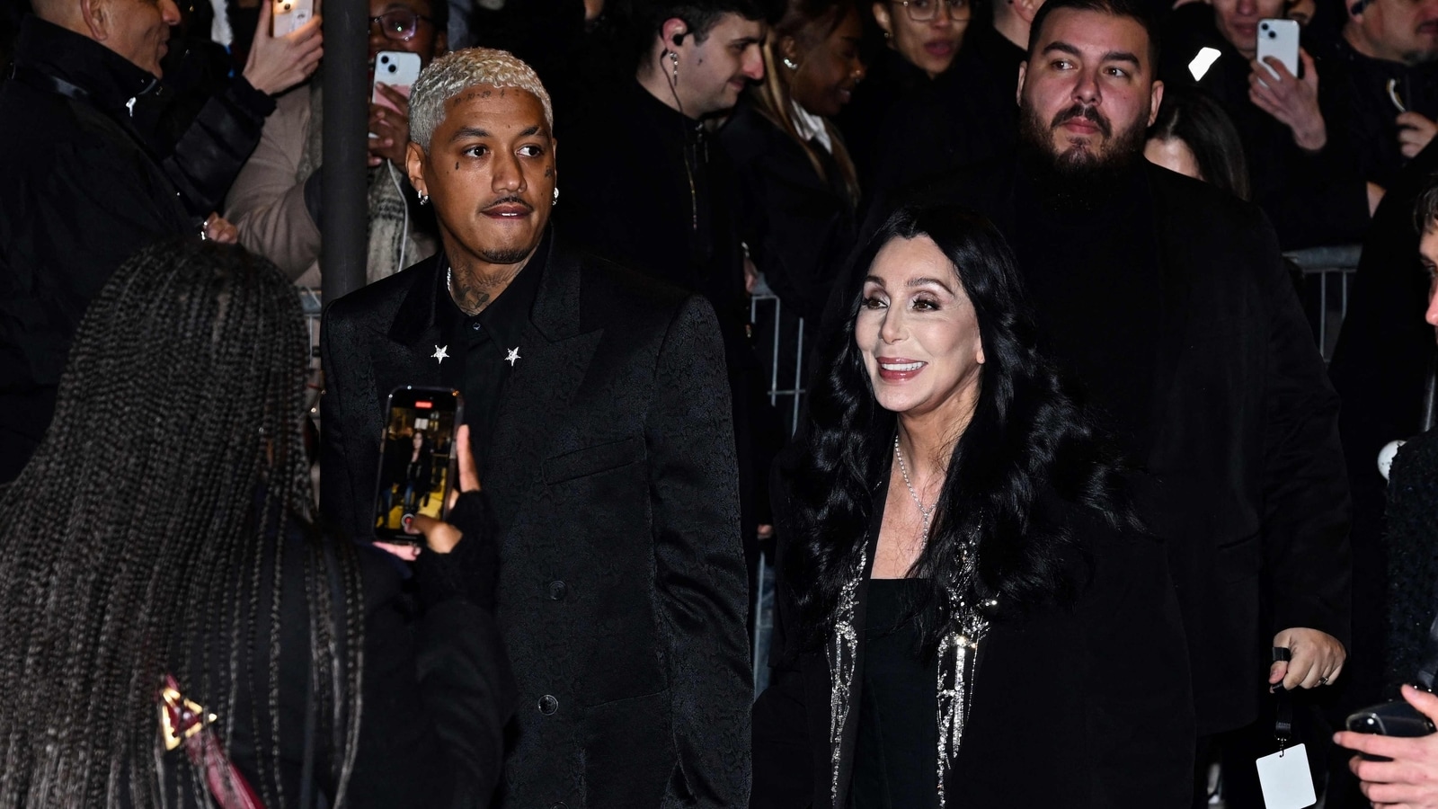 Cher twins with boyfriend Alexander Edwards, 38, at Paris Fashion Week, fans amazed at her youthfulness at 77