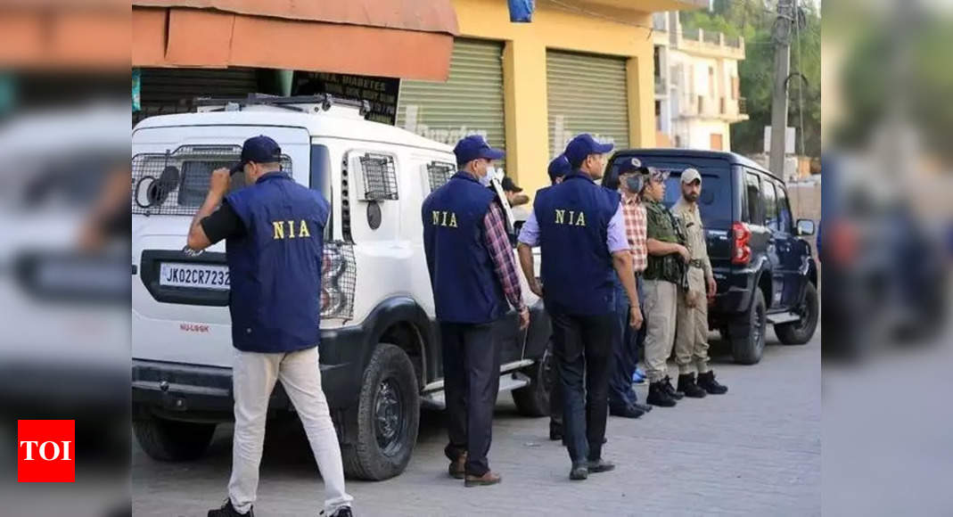 On trail of terrorist-criminal nexus, NIA raids 16 locations | India News - Times of India