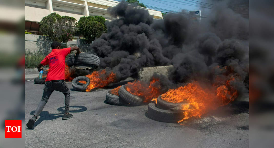 Bowing to global pressure, Haiti PM Ariel Henry says he'll resign amid gang violence - Times of India