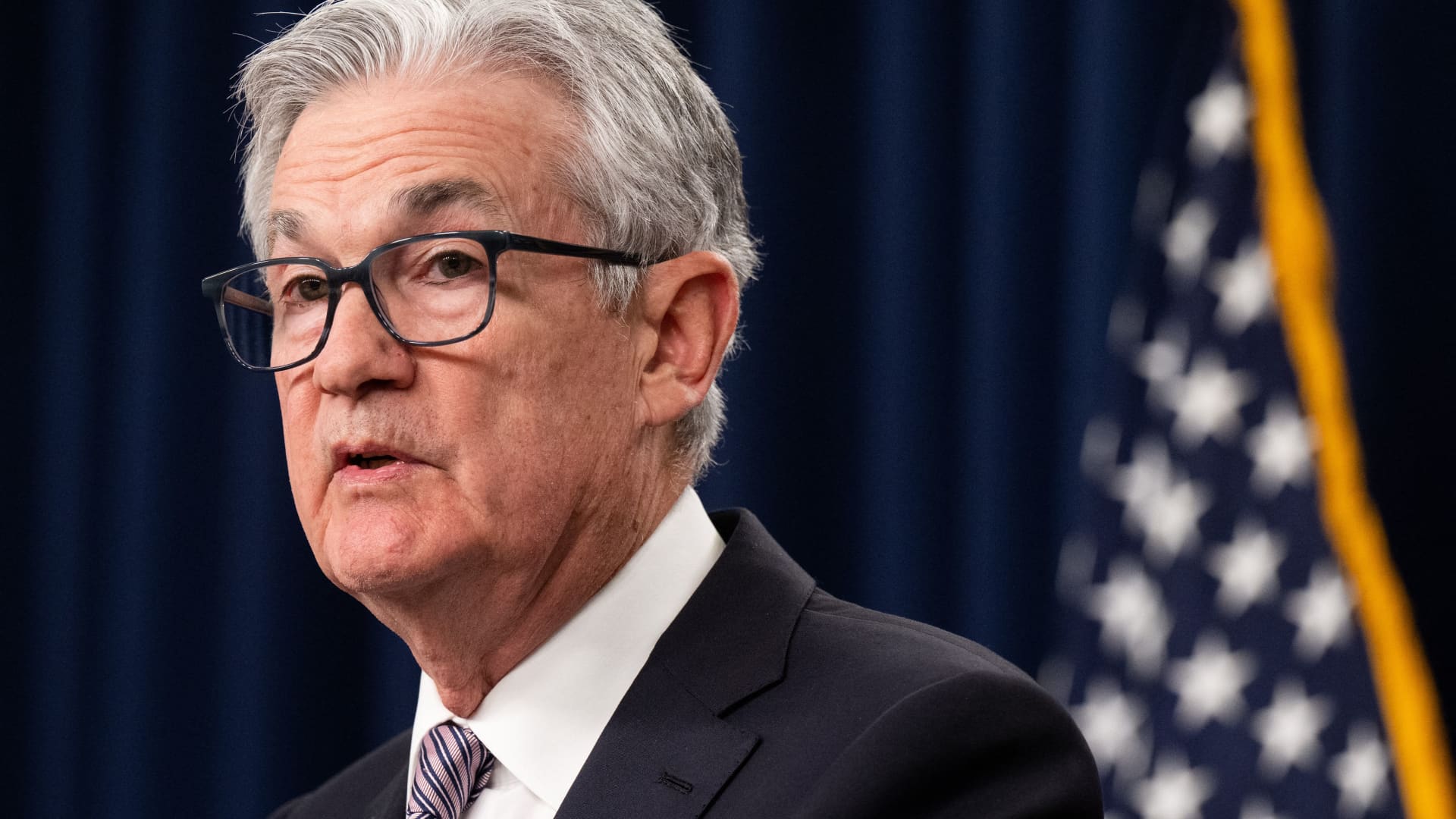 Fed holds rates steady but indicates three cuts coming sometime this year