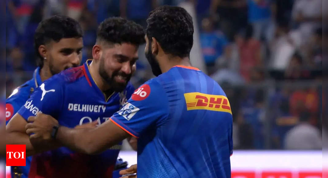 Watch: Mohammed Siraj bows down to Jasprit Bumrah after MI’s win over RCB | Cricket News – Times of India